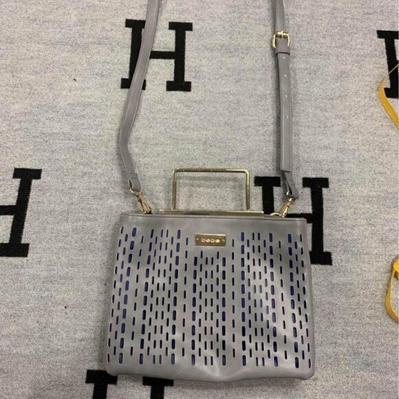 Bebe- gray crossbody bag with gold accents/handle. 2 large compartments. Adjusta - Picture 1 of 10